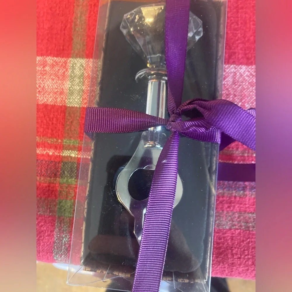 Faux diamond bottle opener. New in box. Super cute & Would make a great gift